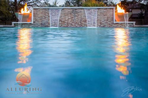 geometric pool with fire and fountain feature